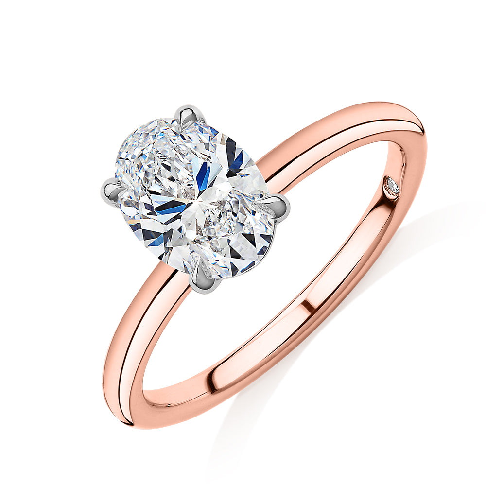 Signature Simulant Diamond 1.50 carat* oval solitaire engagement ring in 14 carat rose and white gold