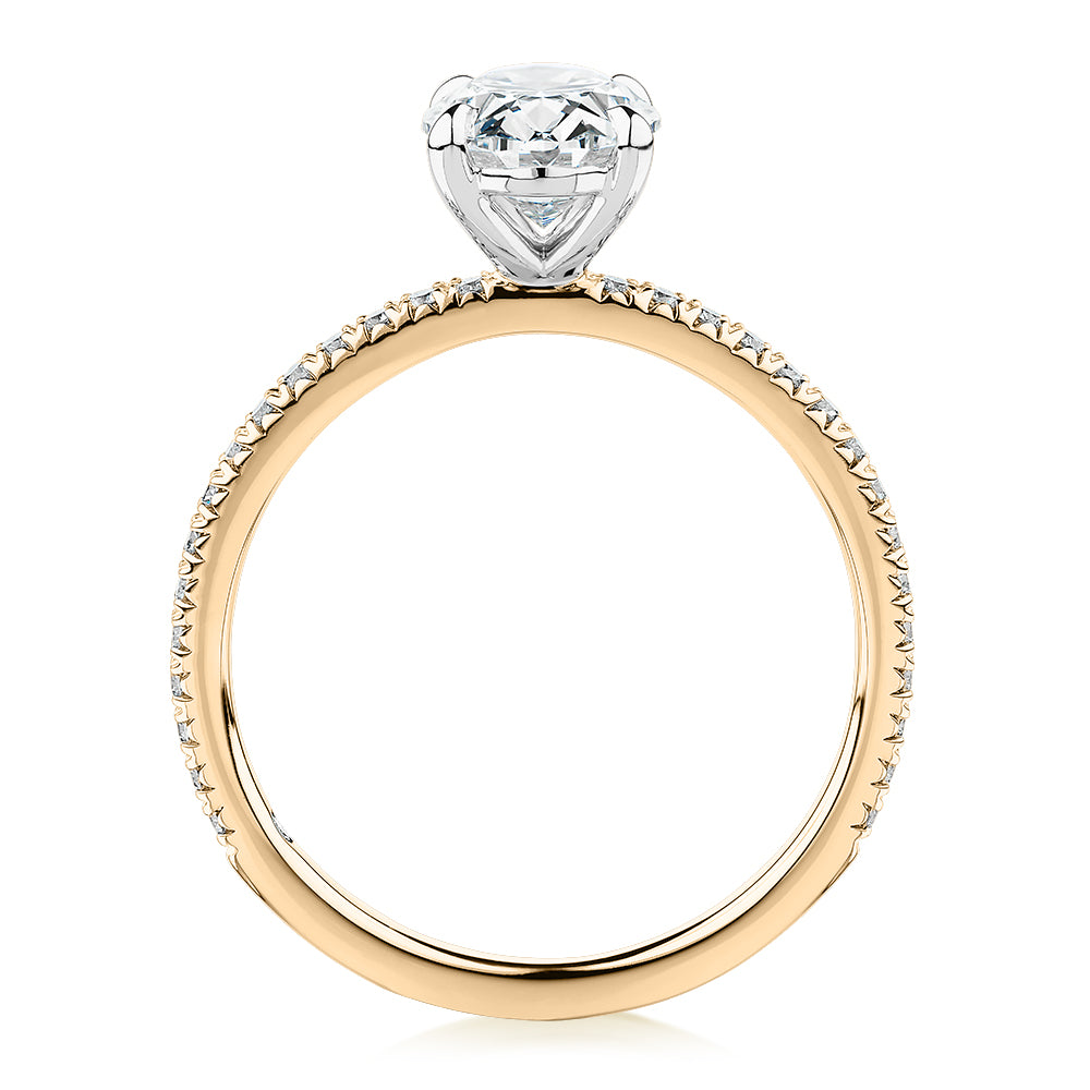 Signature Simulant Diamond 1.74 carat* TW oval and round brilliant shouldered engagement ring in 14 carat yellow and white gold