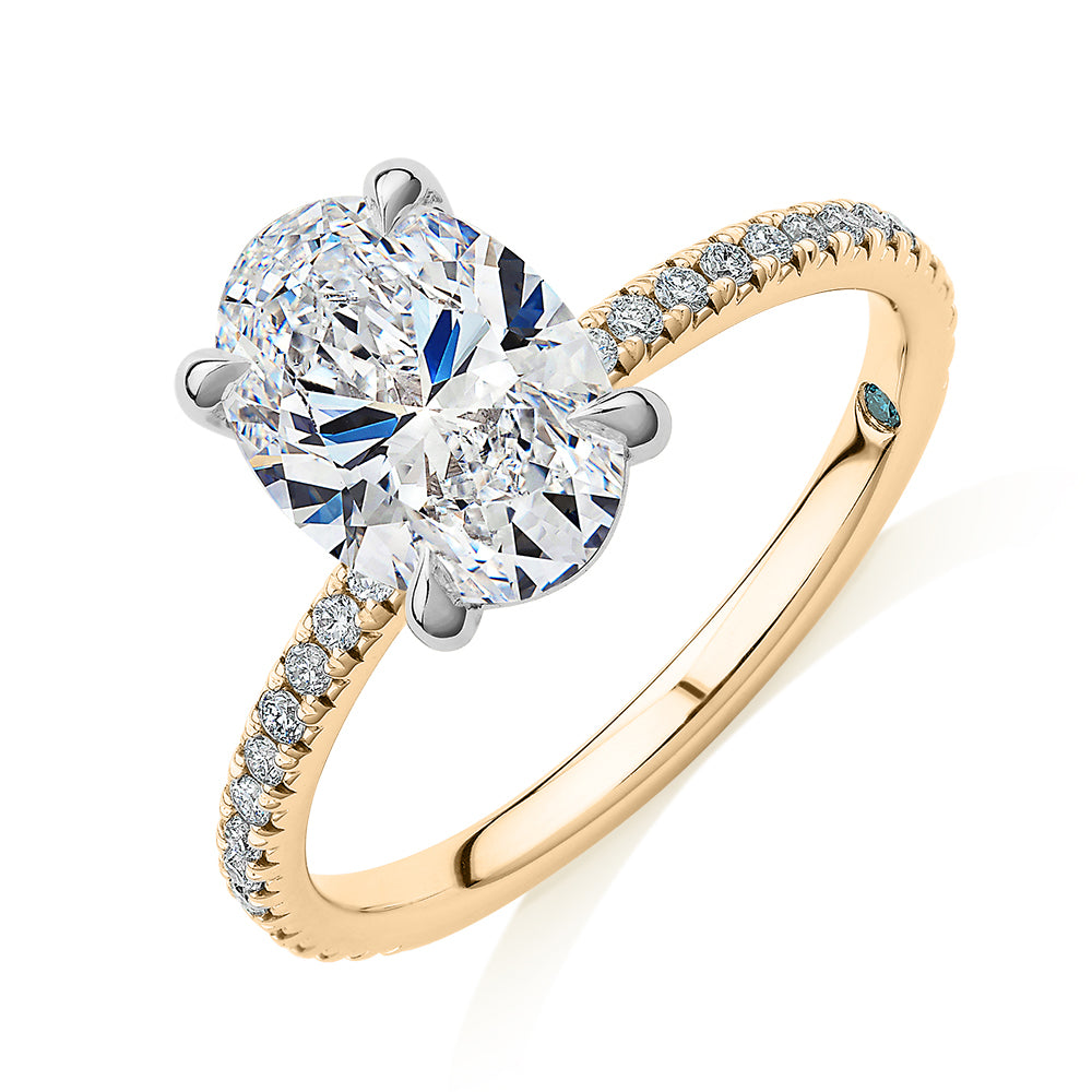 Premium Certified Lab-Grown Diamond, 2.24 carat TW oval and round brilliant shouldered engagement ring in 14 carat yellow and white gold