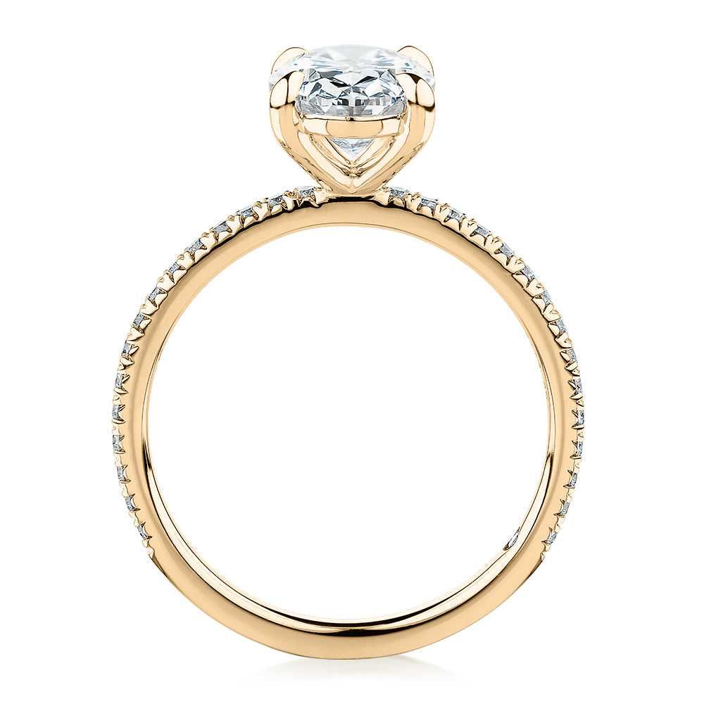 Signature Simulant Diamond 2.24 carat* TW oval and round brilliant shouldered engagement ring in 14 carat yellow gold