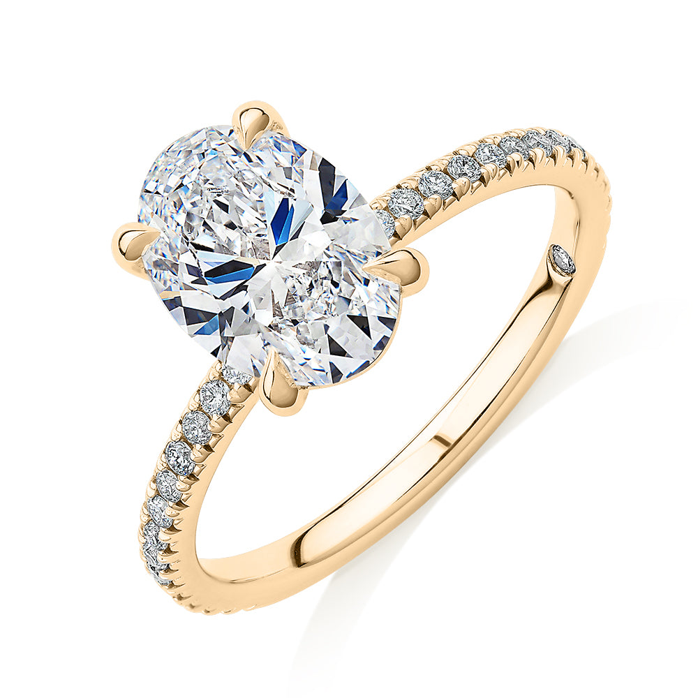 Signature Simulant Diamond 2.24 carat* TW oval and round brilliant shouldered engagement ring in 14 carat yellow gold