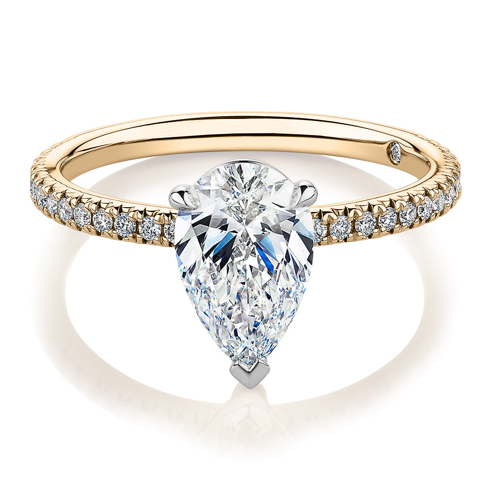 Signature Simulant Diamond 1.74 carat* TW pear and round brilliant shouldered engagement ring in 14 carat yellow and white gold