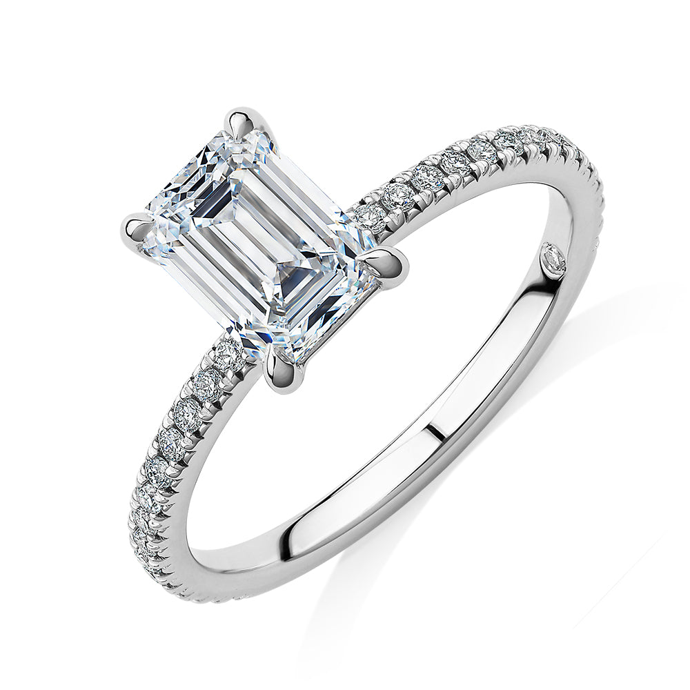 Signature Simulant Diamond 1.74 carat* TW emerald cut and round brilliant shouldered engagement ring in 14 carat white gold