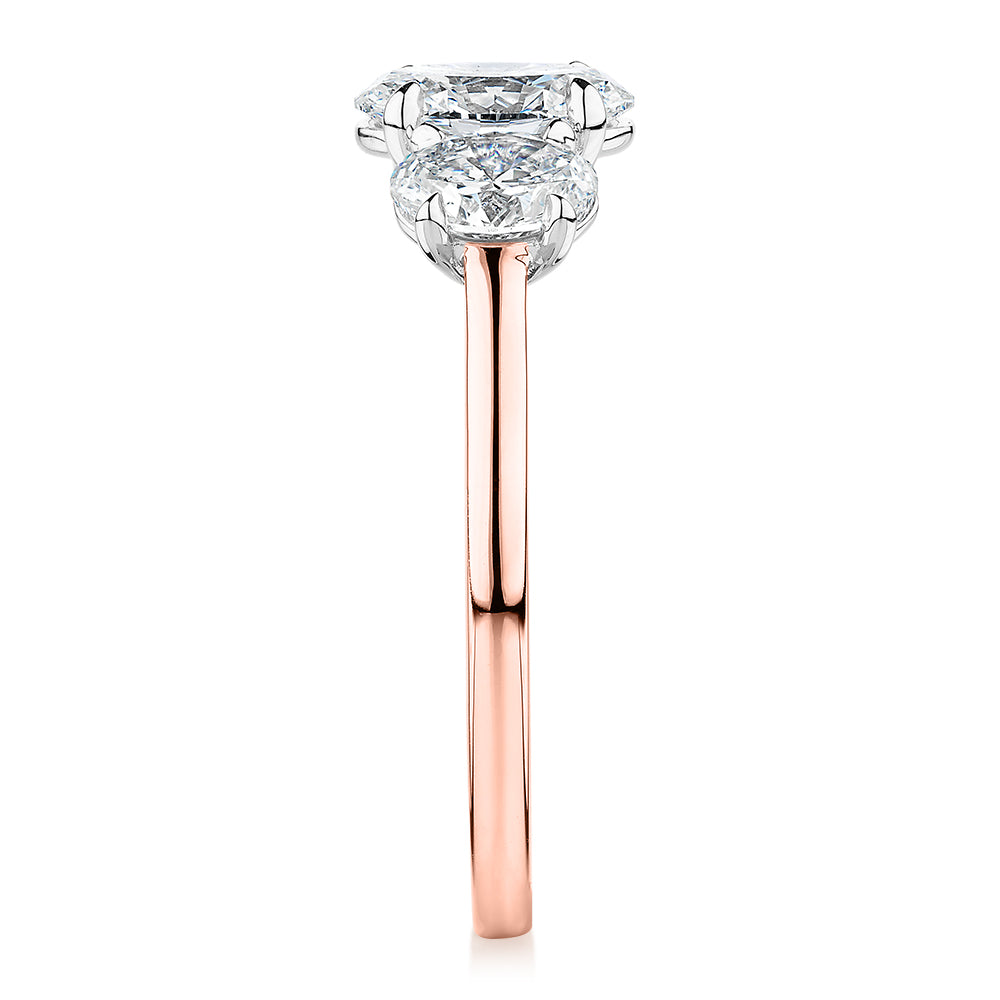 Signature Simulant Diamond 1.87 carat* TW oval three stone ring in 14 carat rose and white gold