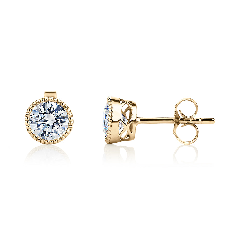 Round Brilliant stud earrings with 1.32 carats* of diamond simulants in 10 carat yellow gold