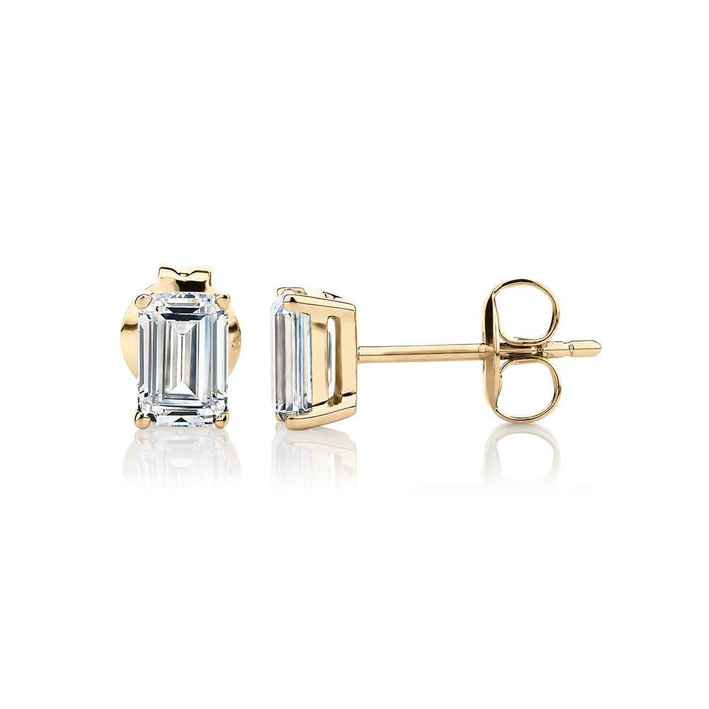 Emerald Cut stud earrings with 1 carat* of diamond simulants in 10 carat yellow gold