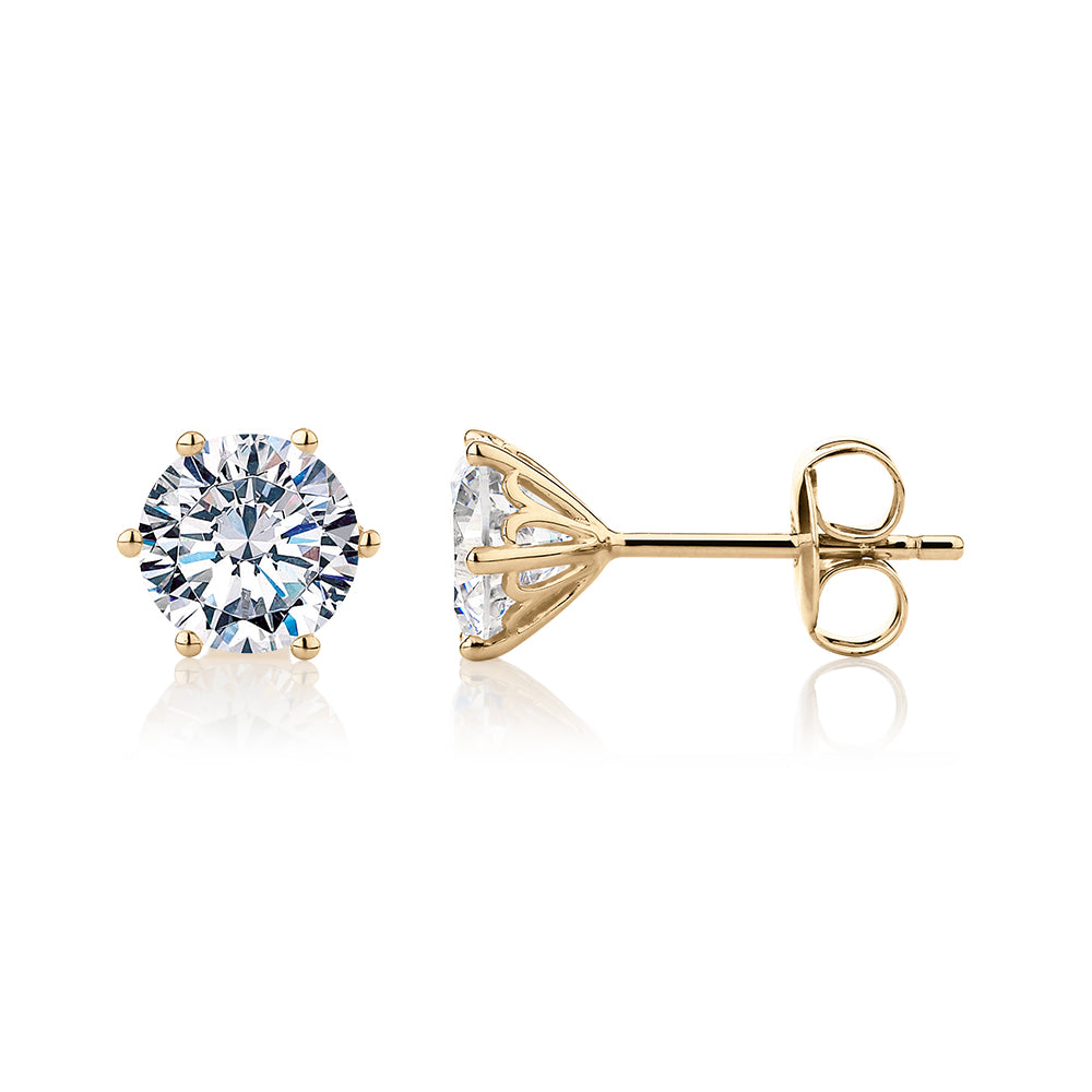 Round Brilliant stud earrings with 2 carats* of diamond simulants in 10 carat yellow gold