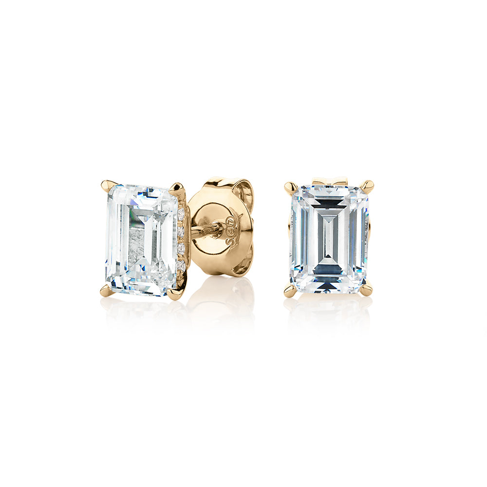 Emerald cut stud earrings with 2.24 carats* of diamond simulants in 10 carat yellow gold