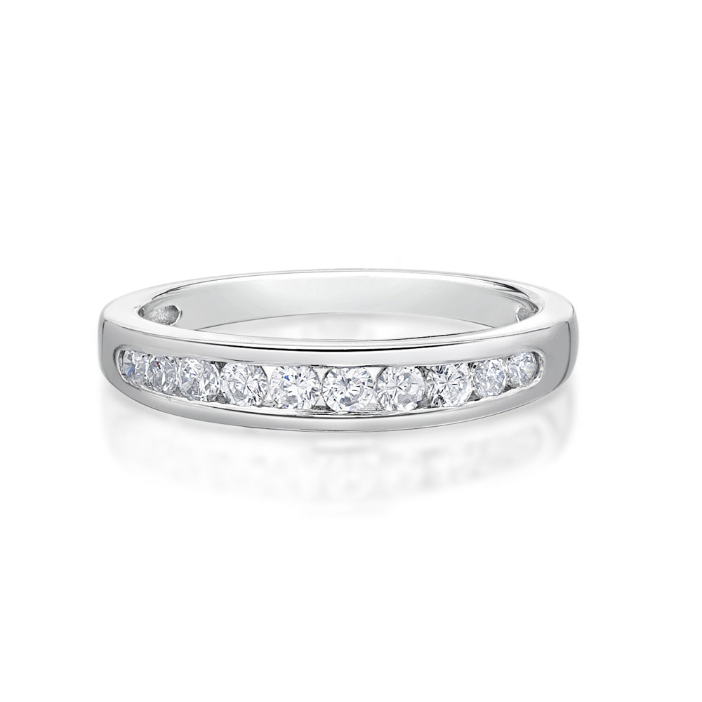 Round brilliant channel set wedding band in 14 carat white gold