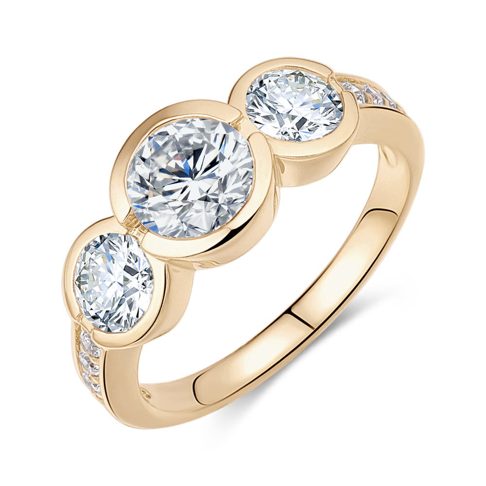 Three stone ring with 2.11 carats* of diamond simulants in 10 carat yellow gold
