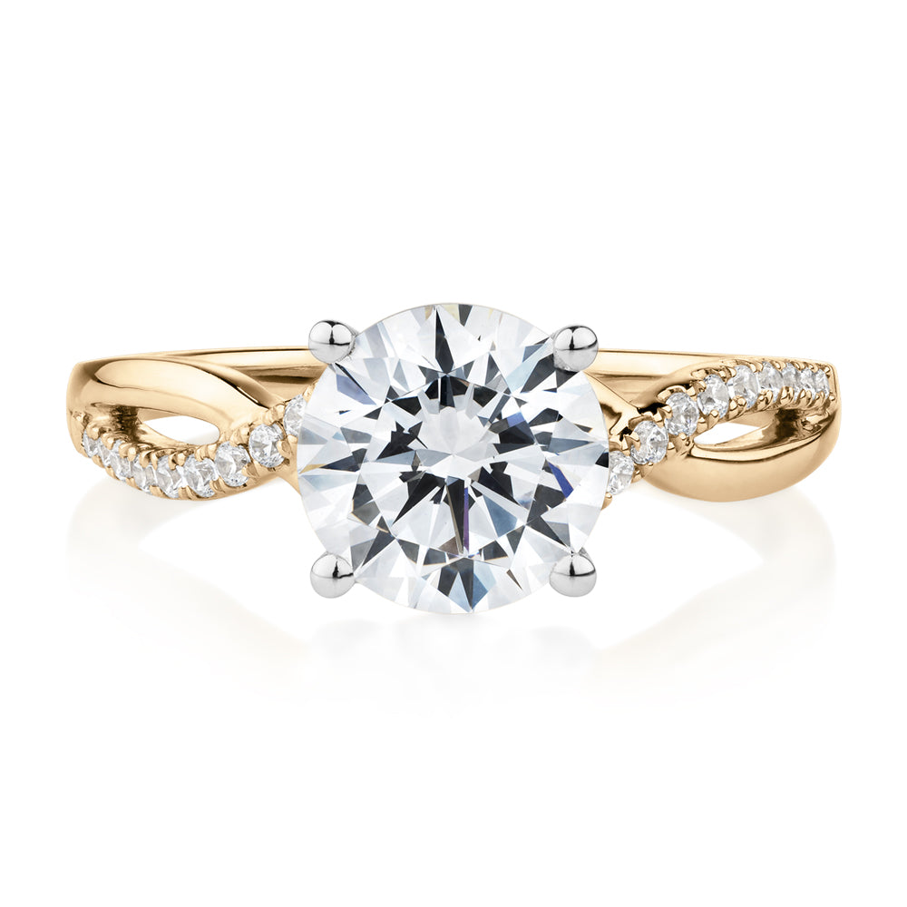 Round Brilliant shouldered engagement ring with 2.17 carats* of diamond simulants in 14 carat yellow and white gold