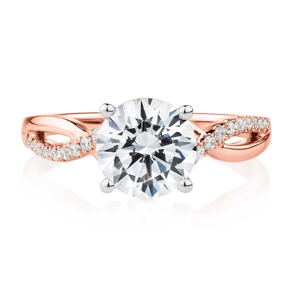 Round Brilliant shouldered engagement ring with 2.17 carats* of diamond simulants in 14 carat rose and white gold