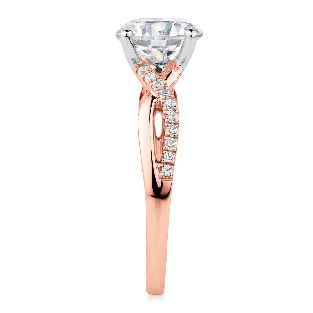 Round Brilliant shouldered engagement ring with 2.17 carats* of diamond simulants in 14 carat rose and white gold