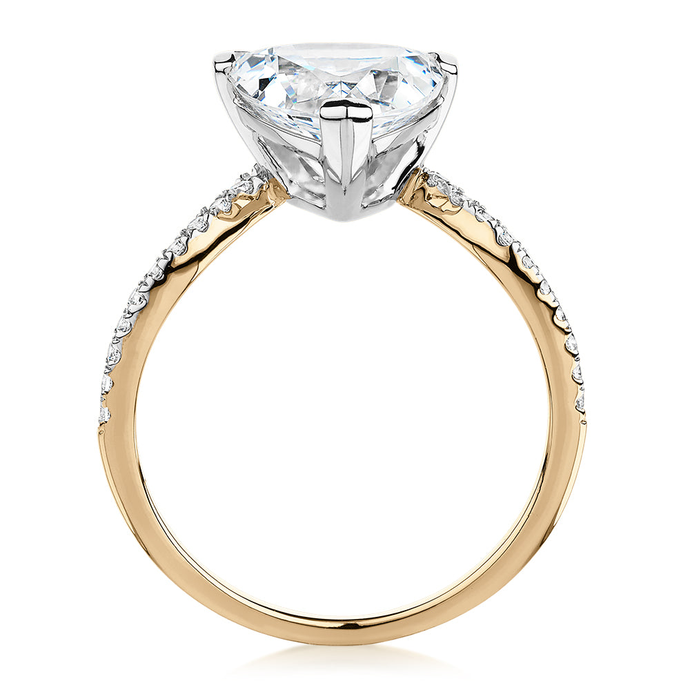 Trilliant and Round Brilliant shouldered engagement ring with 2.52 carats* of diamond simulants in 14 carat yellow and white gold