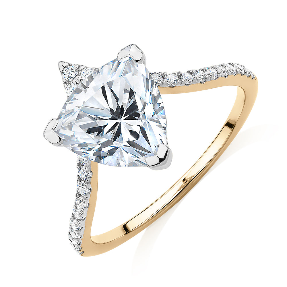 Trilliant and Round Brilliant shouldered engagement ring with 2.52 carats* of diamond simulants in 14 carat yellow and white gold
