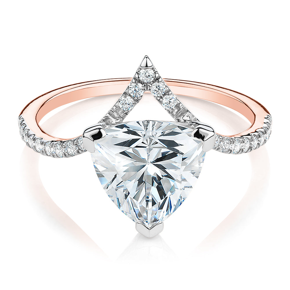 Trilliant and Round Brilliant shouldered engagement ring with 2.52 carats* of diamond simulants in 14 carat rose and white gold