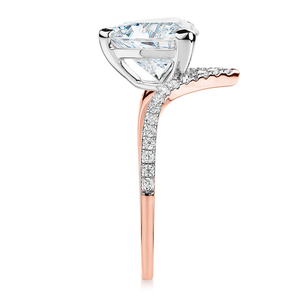 Trilliant and Round Brilliant shouldered engagement ring with 2.52 carats* of diamond simulants in 14 carat rose and white gold