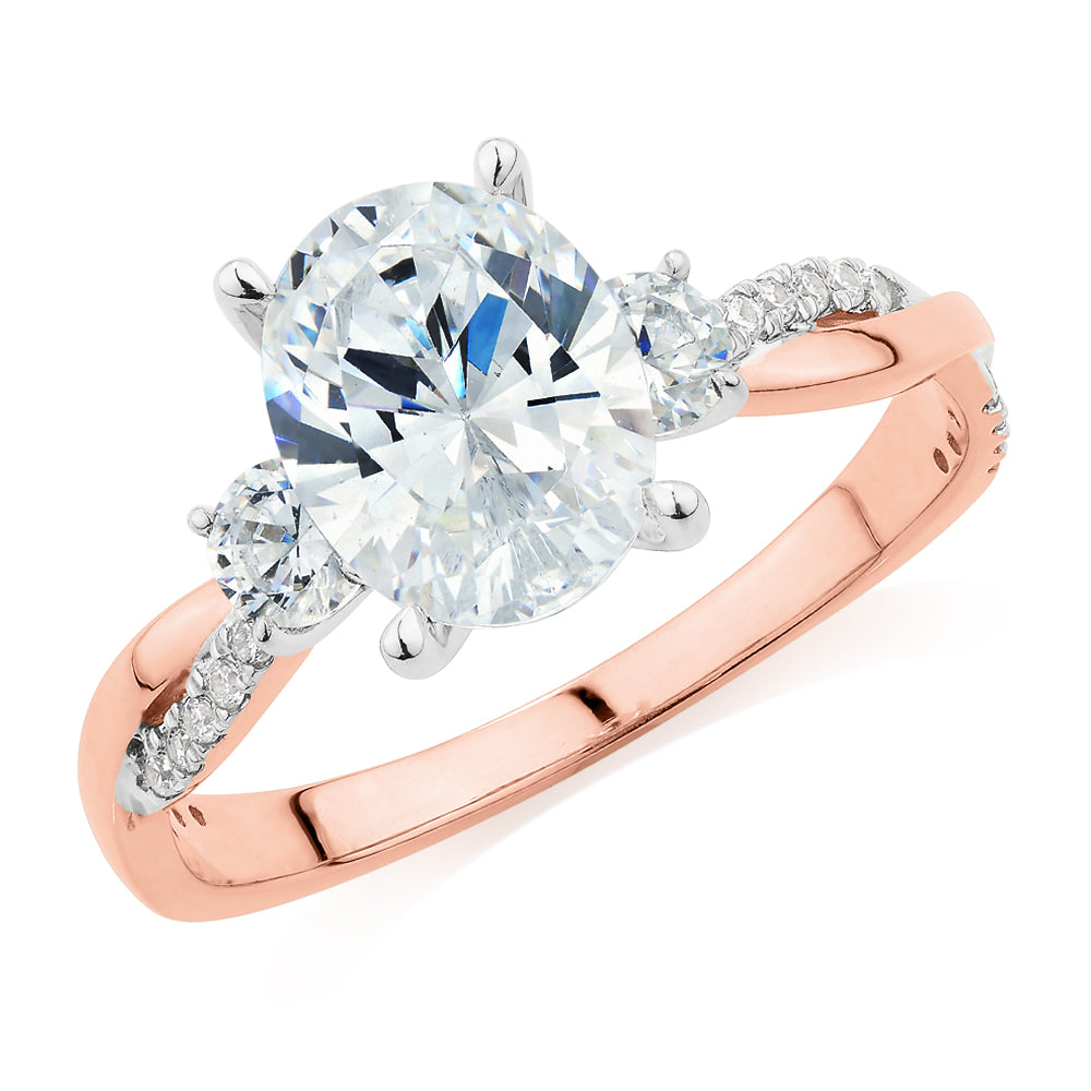 Oval and Round Brilliant shouldered engagement ring with 2.17 carats* of diamond simulants in 14 carat rose and white gold
