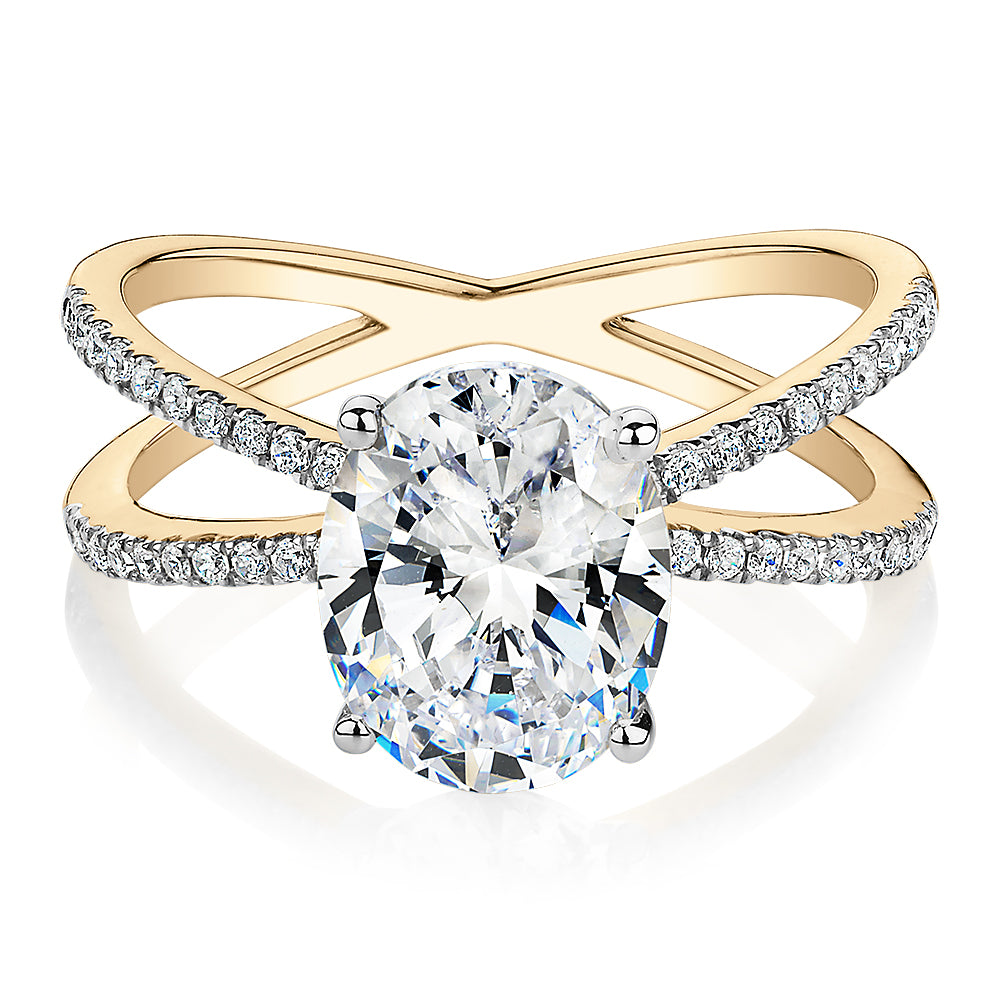 Oval and Round Brilliant shouldered engagement ring with 2.76 carats* of diamond simulants in 14 carat yellow and white gold