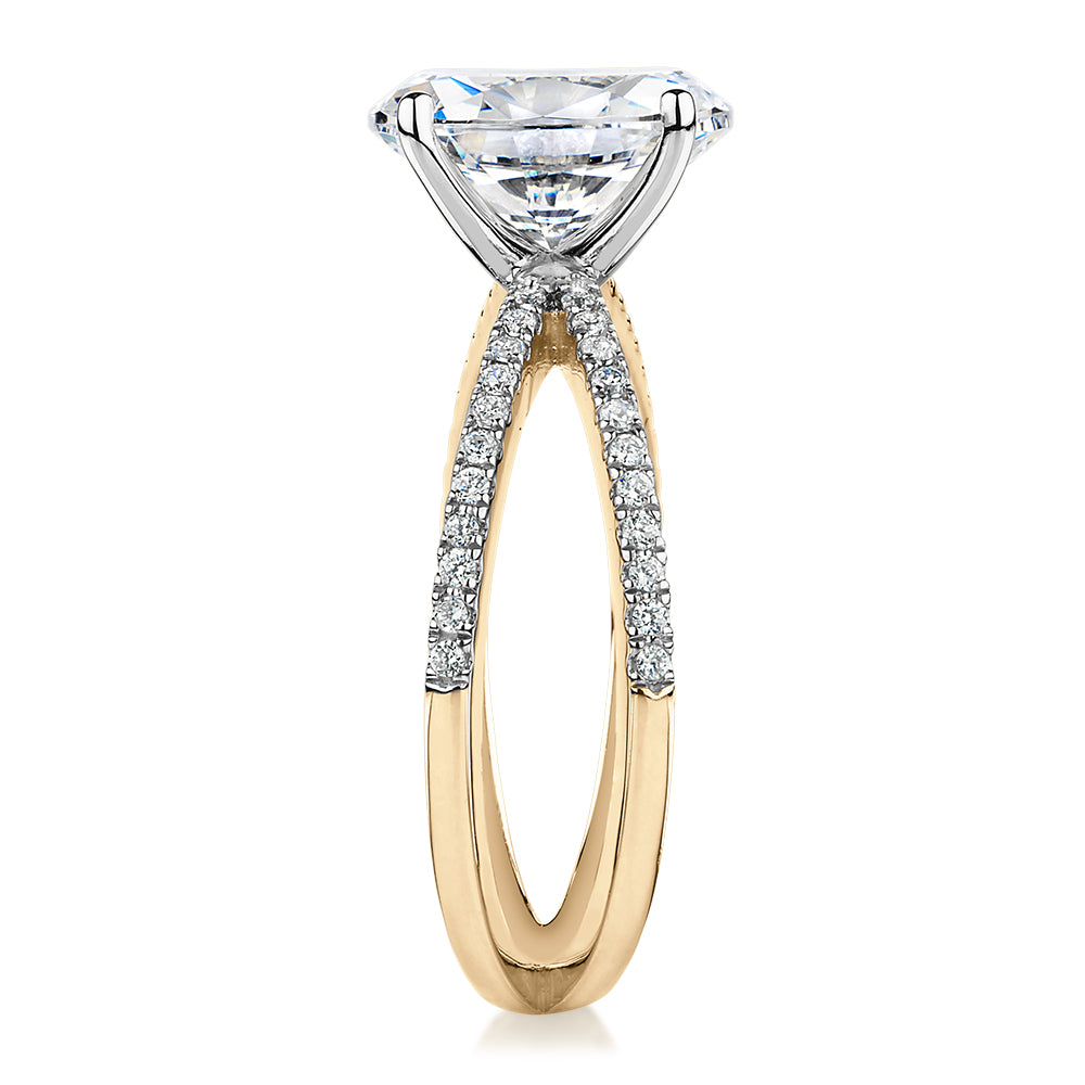 Oval and Round Brilliant shouldered engagement ring with 2.76 carats* of diamond simulants in 14 carat yellow and white gold