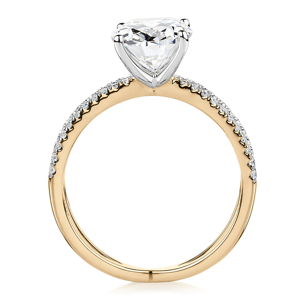 Oval and Round Brilliant shouldered engagement ring with 2.76 carats* of diamond simulants in 14 carat yellow and white gold