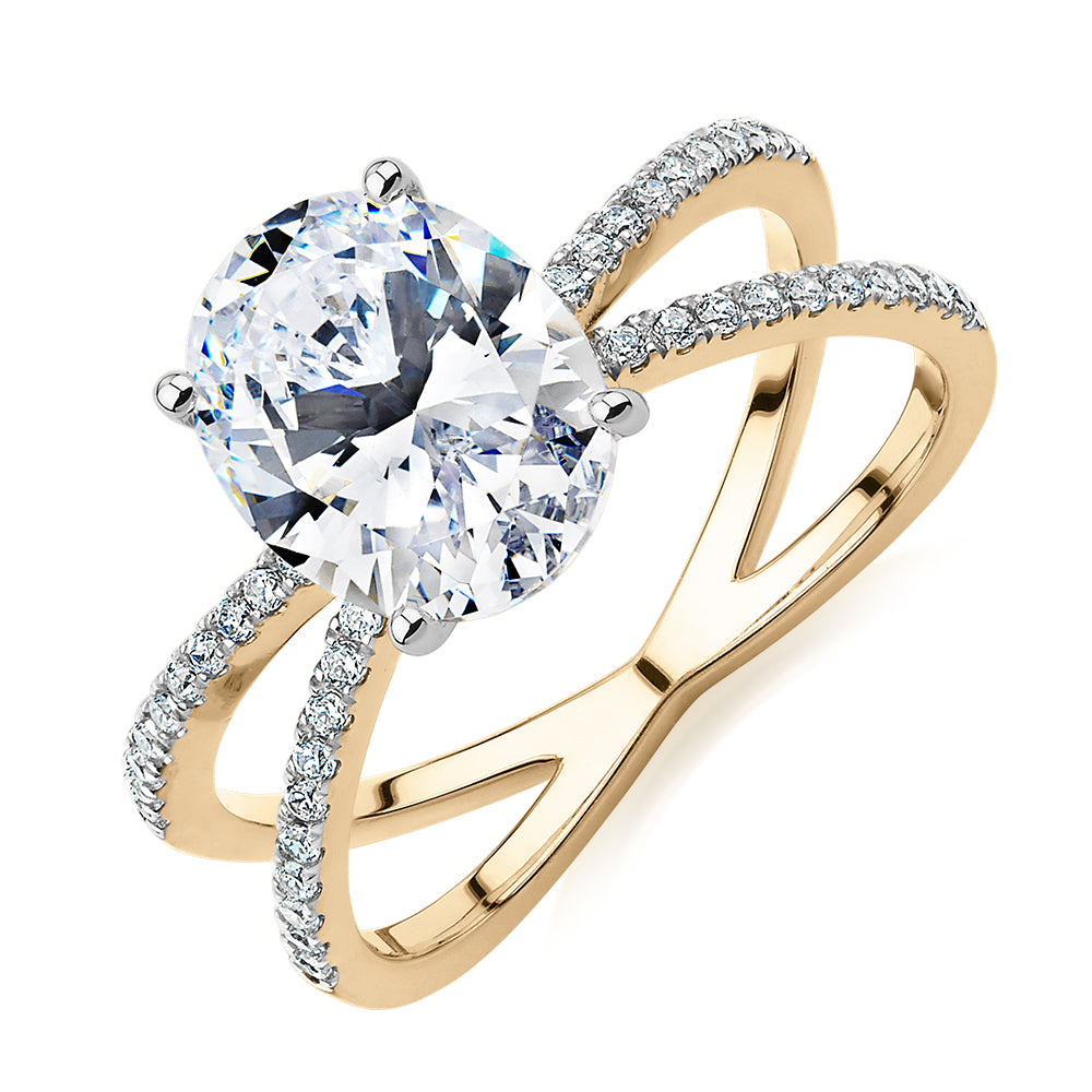 Oval and Round Brilliant shouldered engagement ring with 2.76 carats* of diamond simulants in 14 carat yellow and white gold