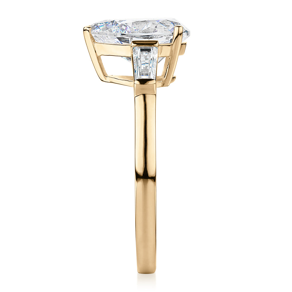 Pear shouldered engagement ring with 2.88 carats* of diamond simulants in 10 carat yellow gold