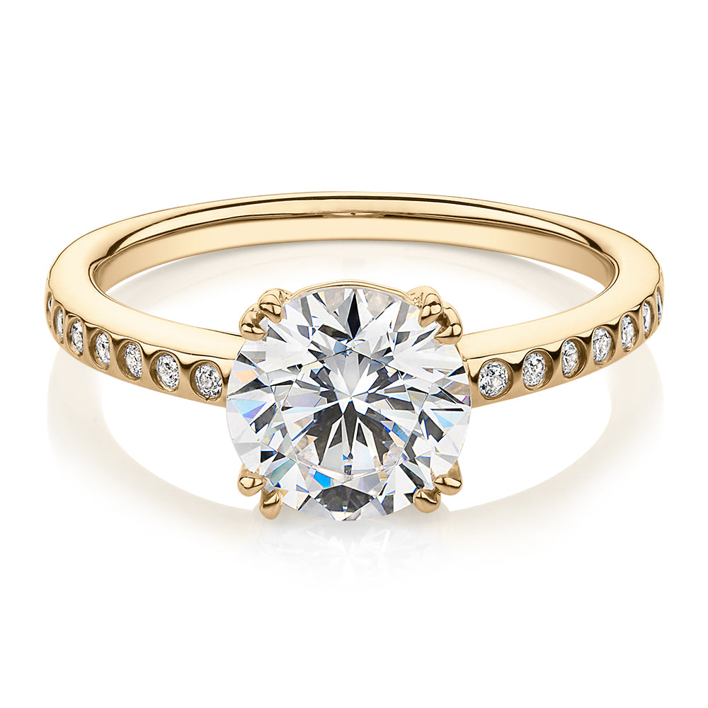 Round Brilliant shouldered engagement ring with 2.17 carats* of diamond simulants in 14 carat yellow gold