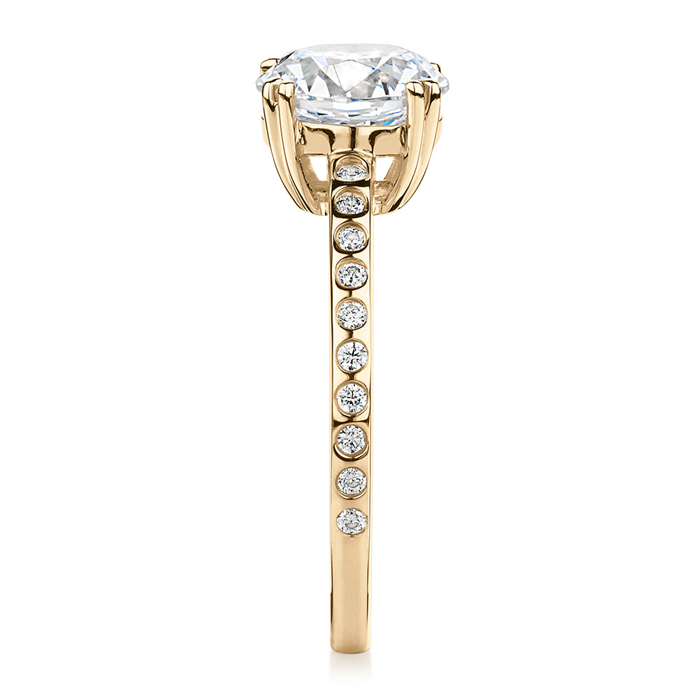 Round Brilliant shouldered engagement ring with 2.17 carats* of diamond simulants in 14 carat yellow gold