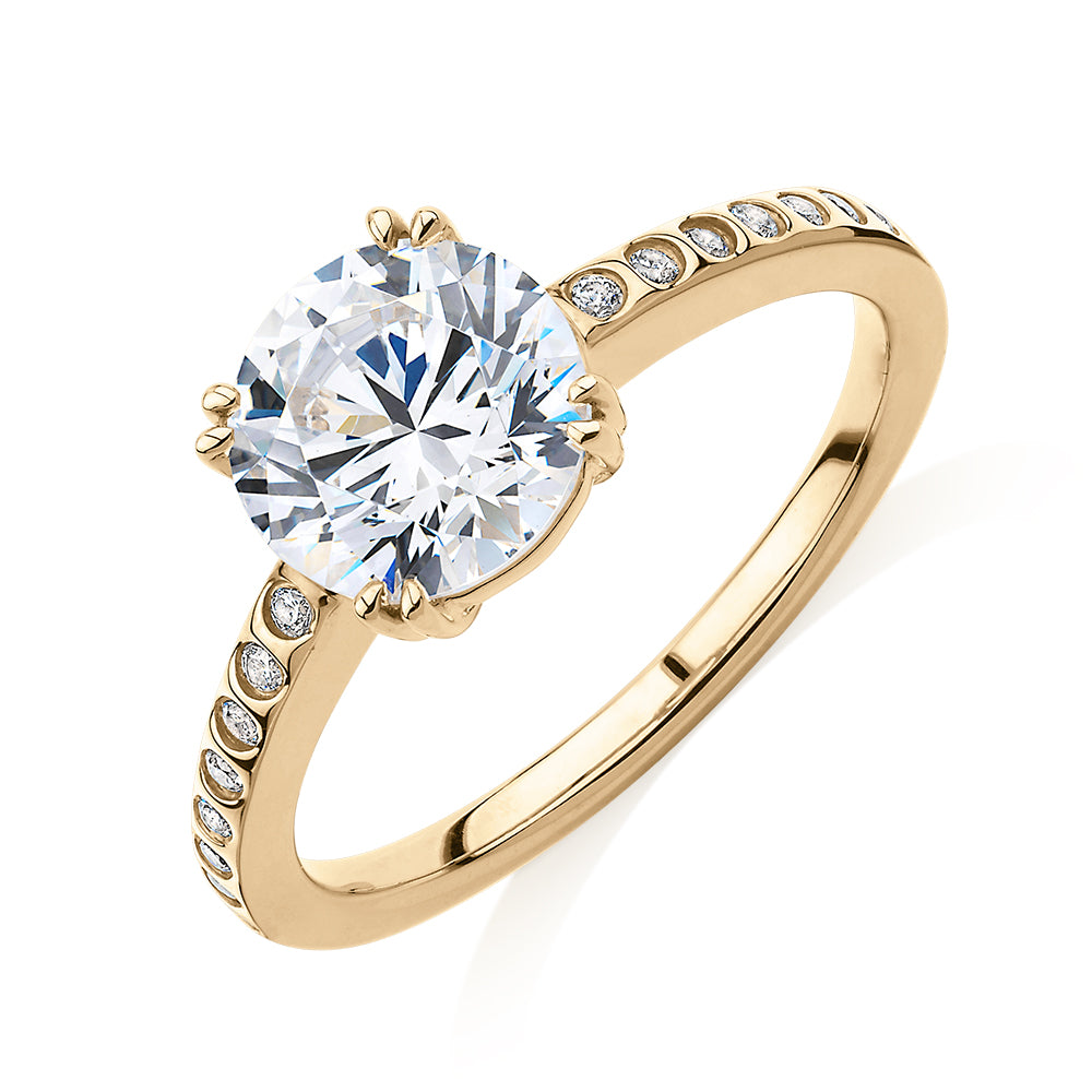 Round Brilliant shouldered engagement ring with 2.17 carats* of diamond simulants in 14 carat yellow gold