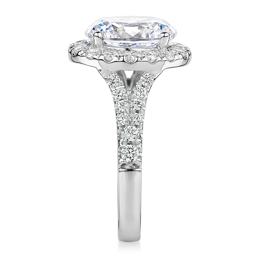 Oval and Round Brilliant halo engagement ring with 4.61 carats* of diamond simulants in 10 carat white gold