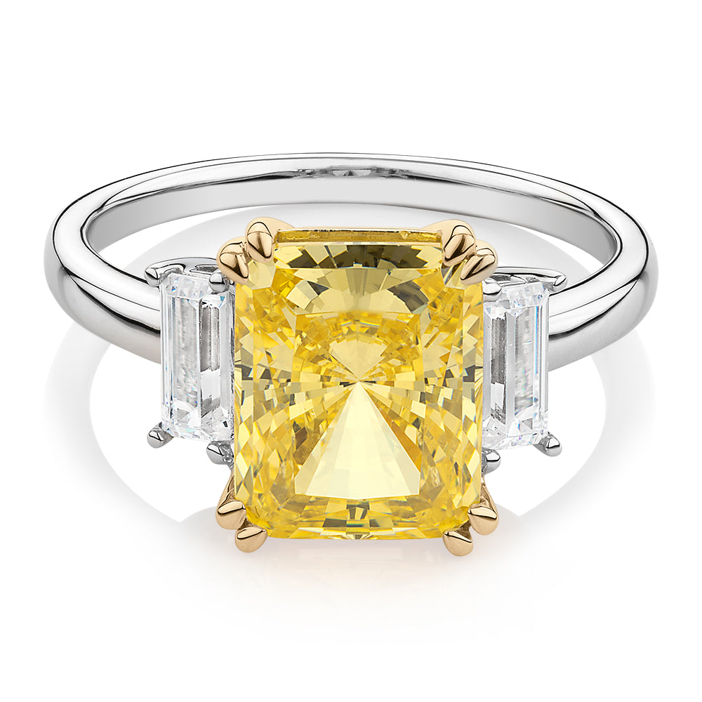 Emerald Cut and Baguette shouldered engagement ring with 4.25 carats* of diamond simulants in 10 carat white and yellow gold