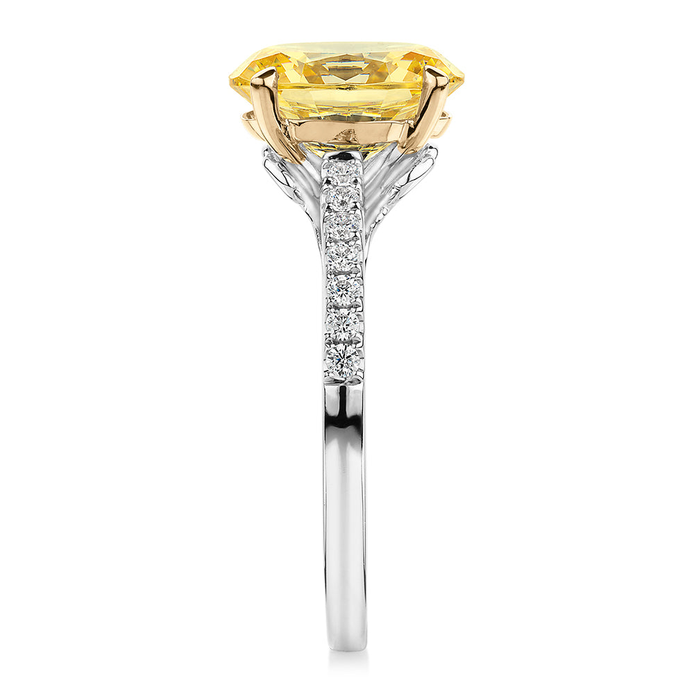 Oval and Round Brilliant shouldered engagement ring with 2.68 carats* of diamond simulants in 10 carat white and yellow gold