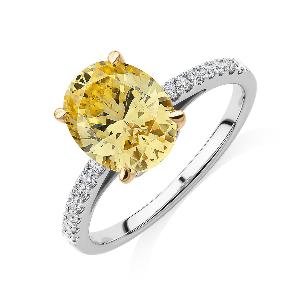 Oval and Round Brilliant shouldered engagement ring with 2.68 carats* of diamond simulants in 10 carat white and yellow gold