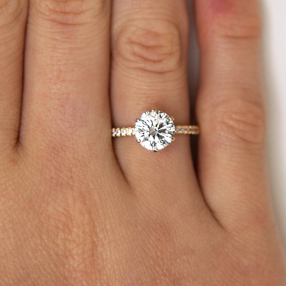 Round Brilliant shouldered engagement ring with 2.12 carats* of diamond simulants in 14 carat yellow gold