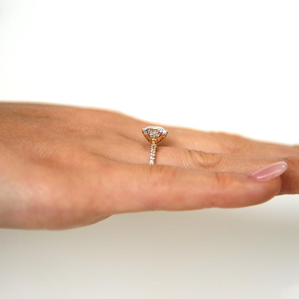 Round Brilliant shouldered engagement ring with 2.12 carats* of diamond simulants in 14 carat yellow gold