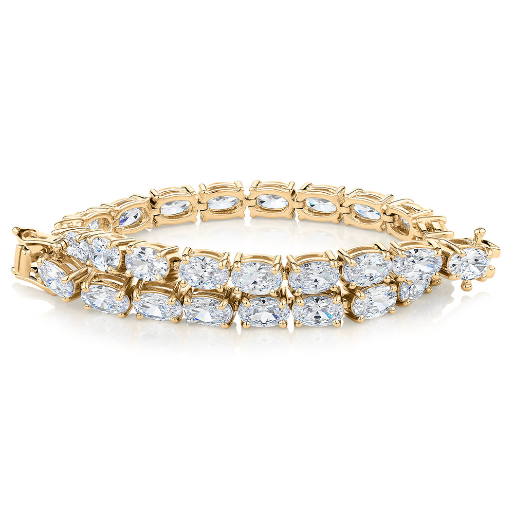 Oval tennis bracelet with 12.04 carats* of diamond simulants in 10 carat yellow gold