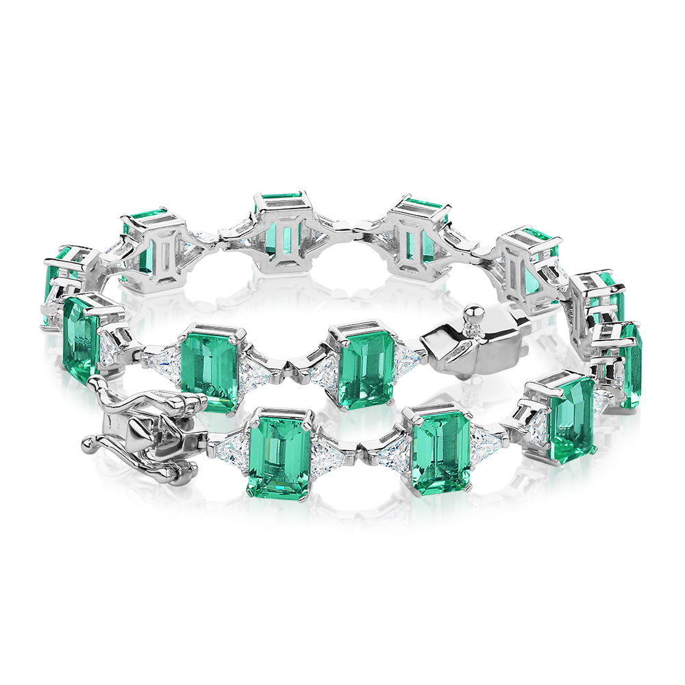 Emerald Cut and Trilliant tennis bracelet with ocean green simulants and 3.12 carats* of diamond simulants in sterling silver