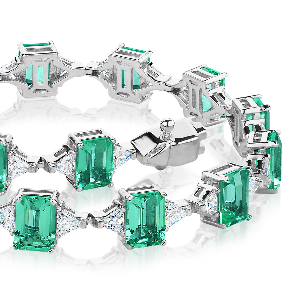 Emerald Cut and Trilliant tennis bracelet with ocean green simulants and 3.12 carats* of diamond simulants in sterling silver