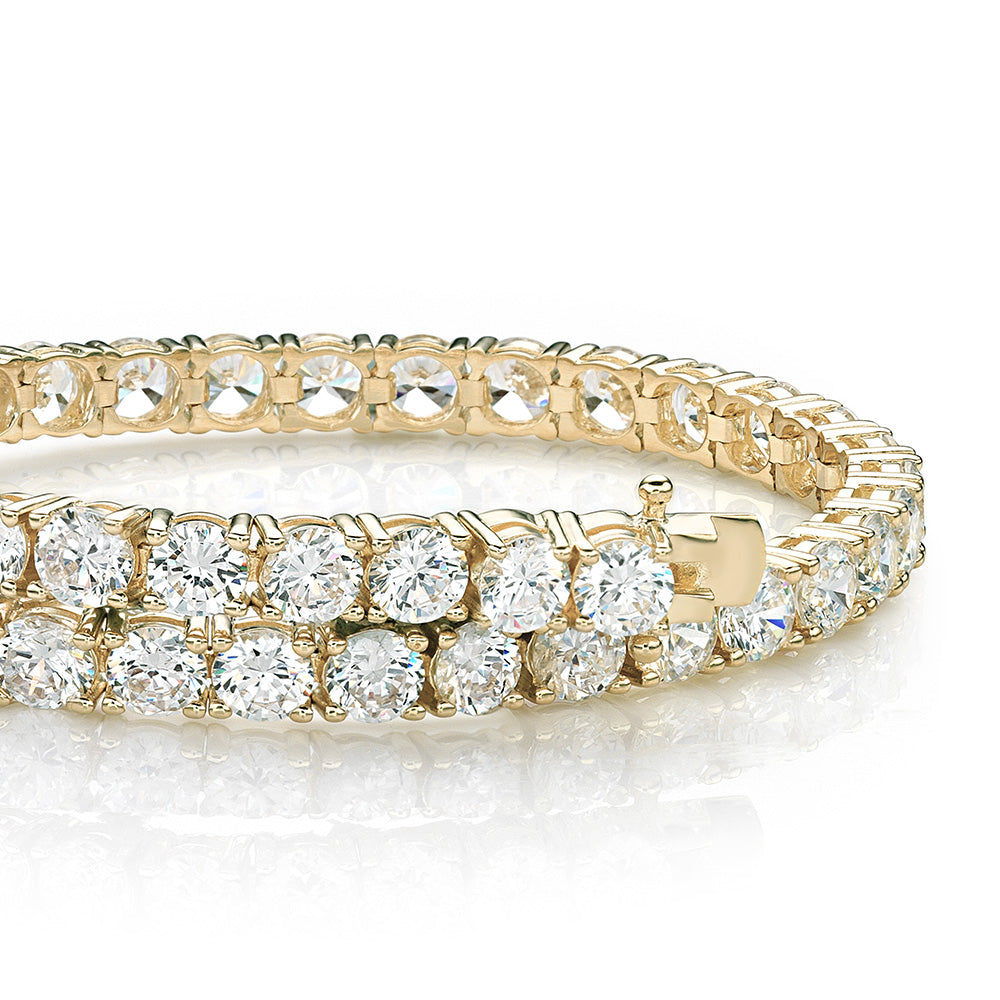 Round Brilliant tennis bracelet with 11 carats* of diamond simulants in 10 carat yellow gold