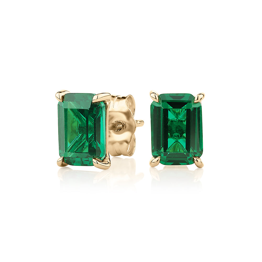 Emerald Cut stud earrings with emerald simulants in 10 carat yellow gold