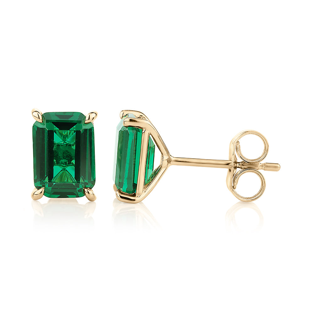 Emerald Cut stud earrings with emerald simulants in 10 carat yellow gold