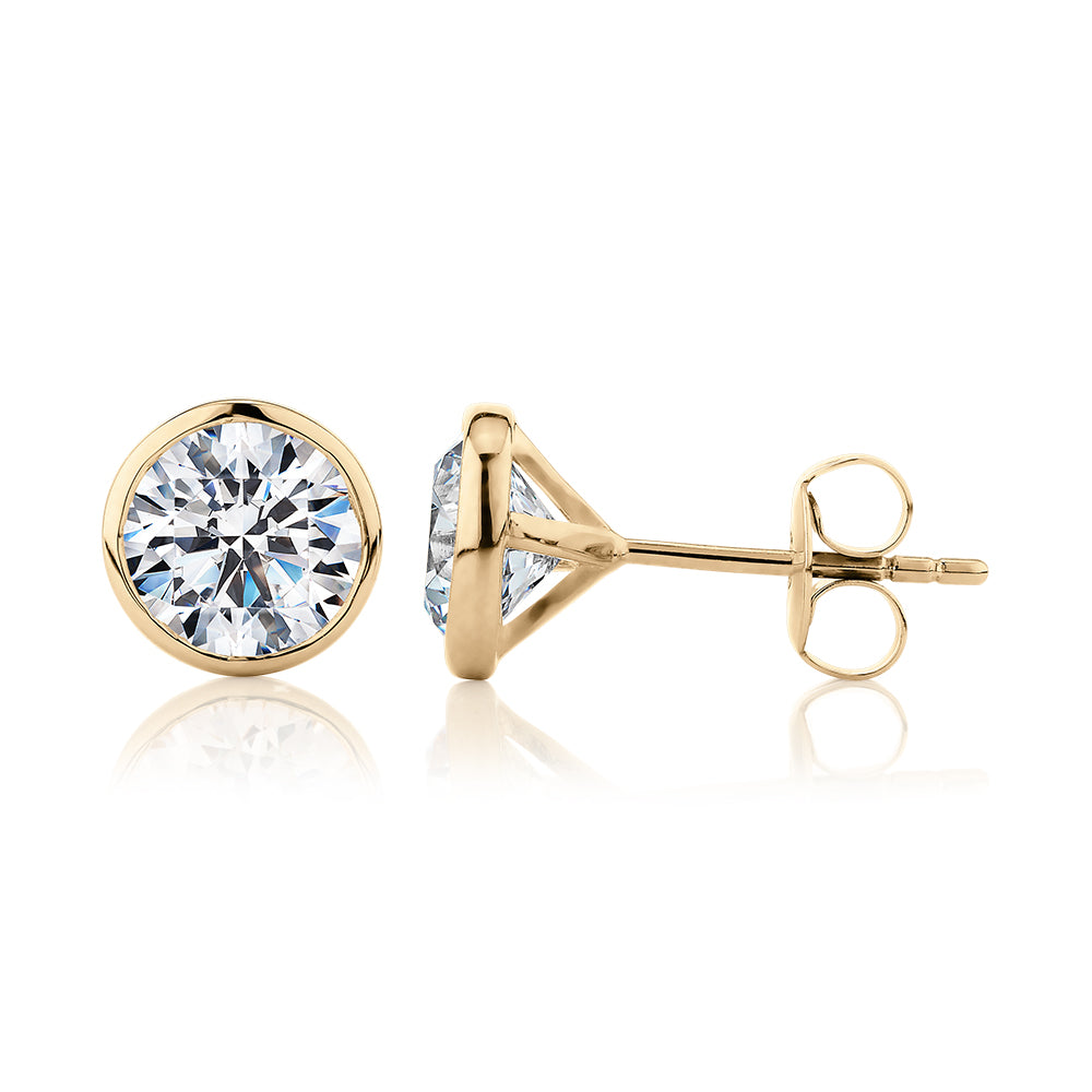 Round Brilliant stud earrings with 3 carats* of diamond simulants in 10 carat yellow gold