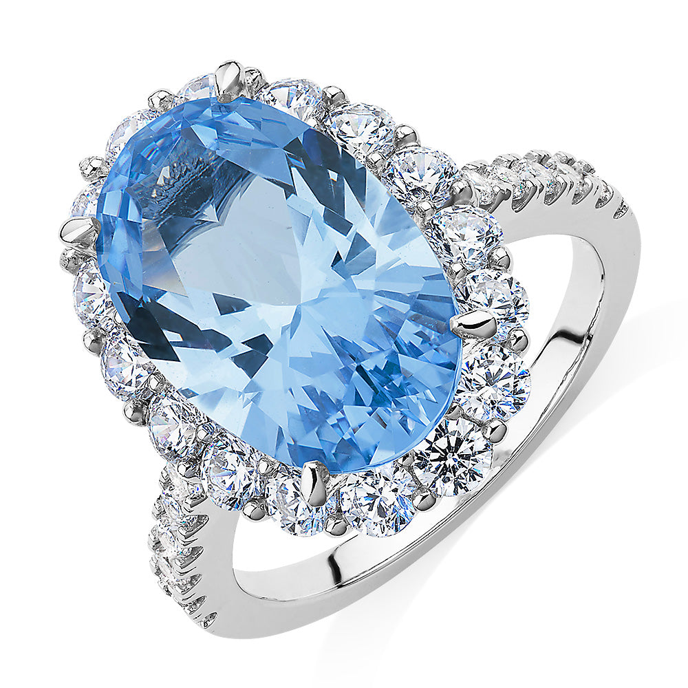 Dress ring with blue topaz simulant and 1.52 carats* of diamond simulants in sterling silver