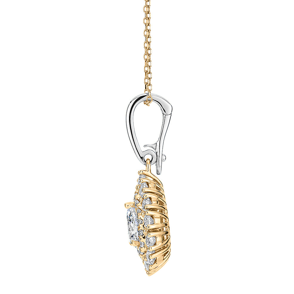 Fancy pendant with 0.91 carats* of diamond simulants in 10 carat yellow gold and sterling silver
