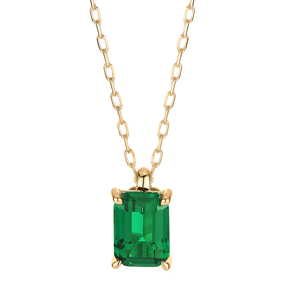 Emerald Cut solitaire pendant with emerald simulant in 10 carat yellow gold