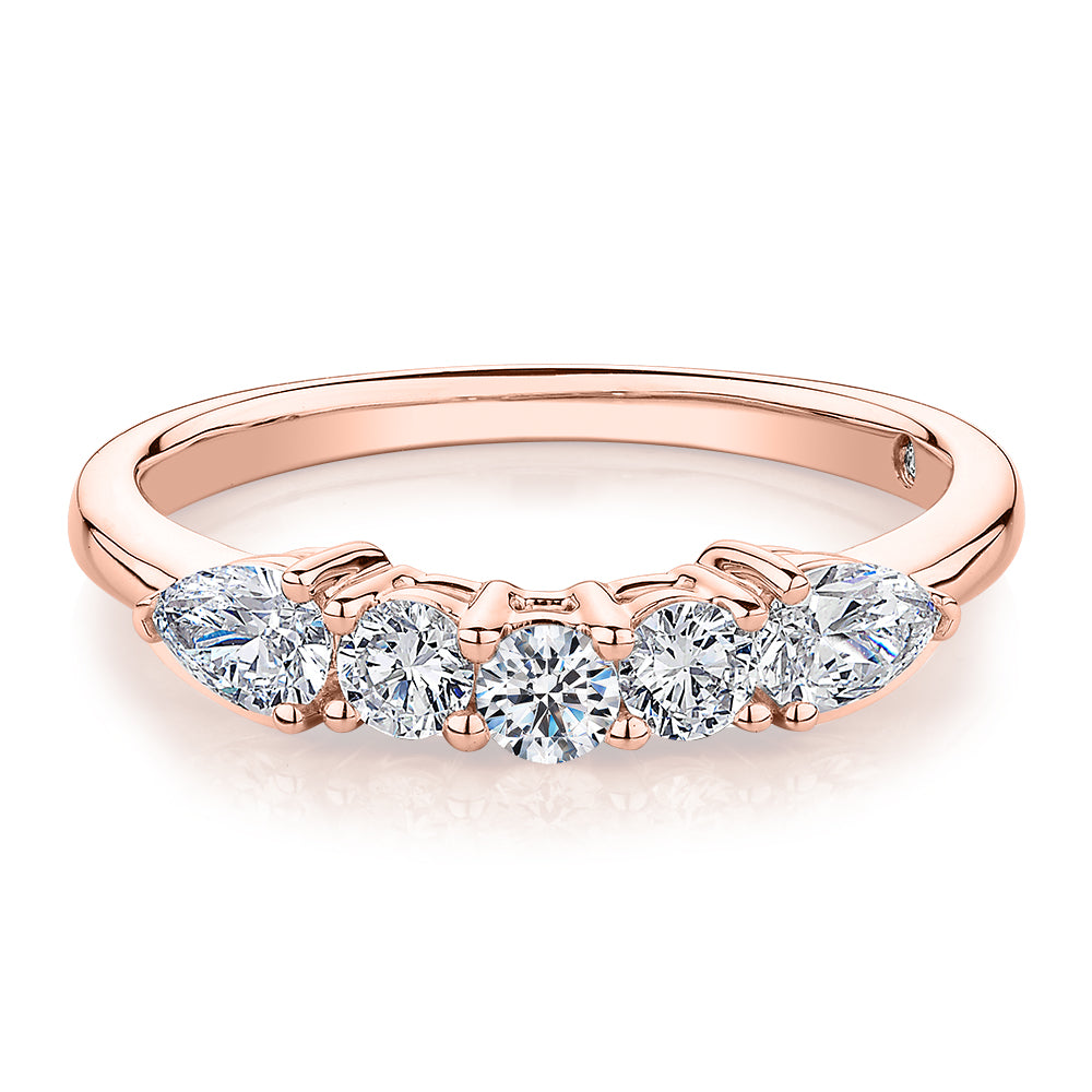 Curved wedding or eternity band with 0.83 carats* of diamond simulants in 14 carat rose gold