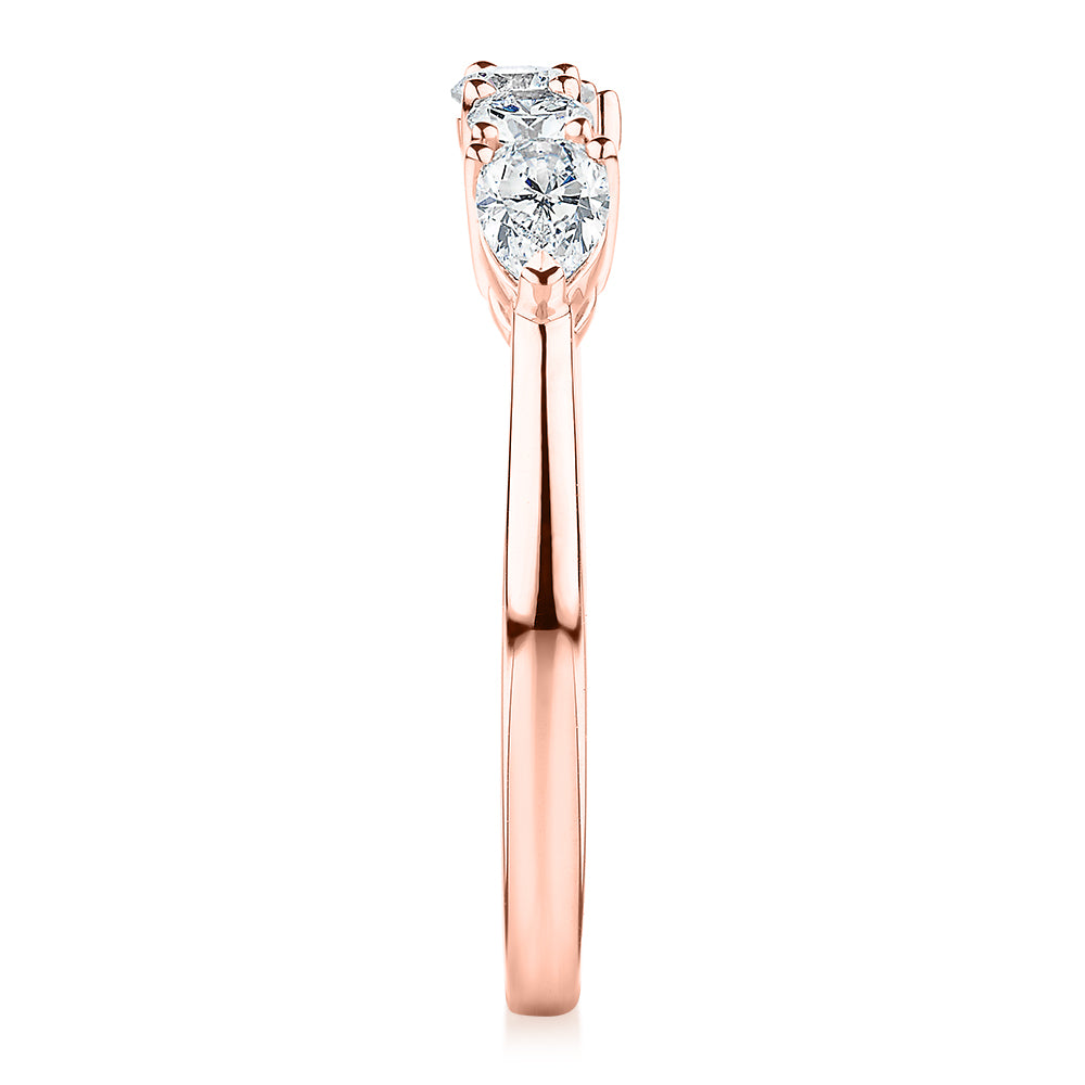 Curved wedding or eternity band with 0.83 carats* of diamond simulants in 14 carat rose gold