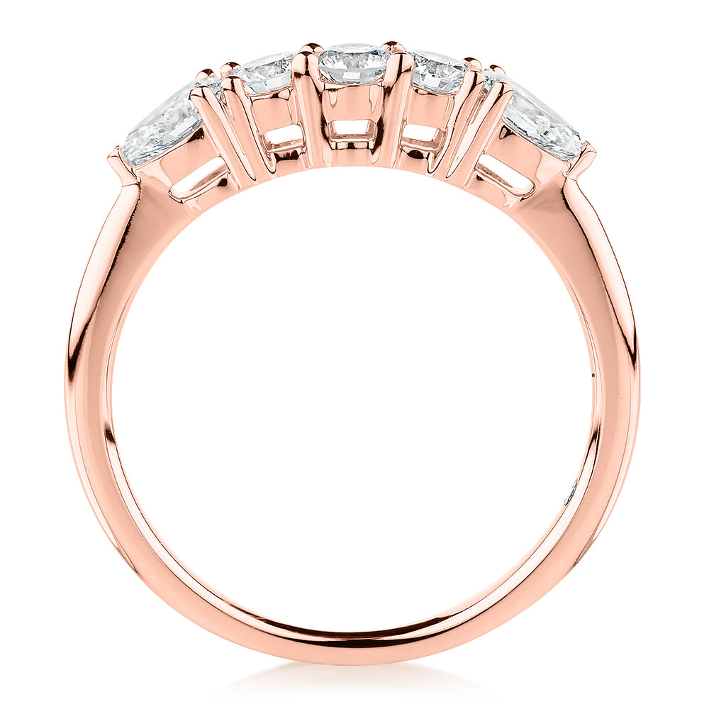 Curved wedding or eternity band with 0.83 carats* of diamond simulants in 14 carat rose gold