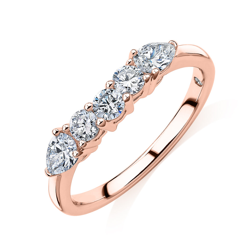 Curved wedding or eternity band with 0.83 carats* of diamond simulants in 14 carat rose gold